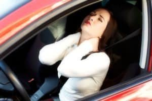 Person in vehicle accident suffering from neck pain